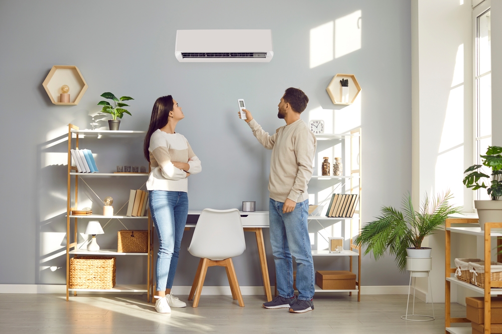 Family,couple,using,a,convenient,air,conditioning,system,at,home.